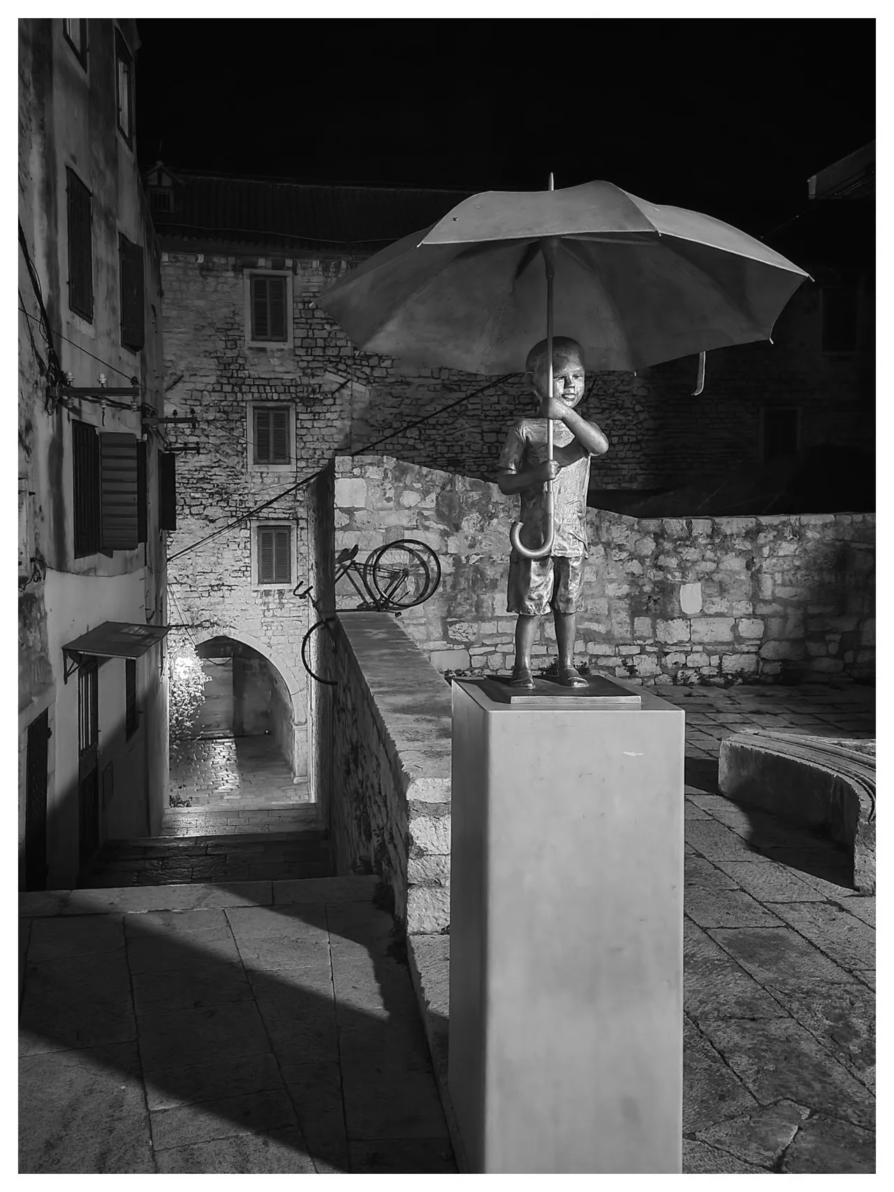 Iron statue of Boy with Umbrella - Croatia